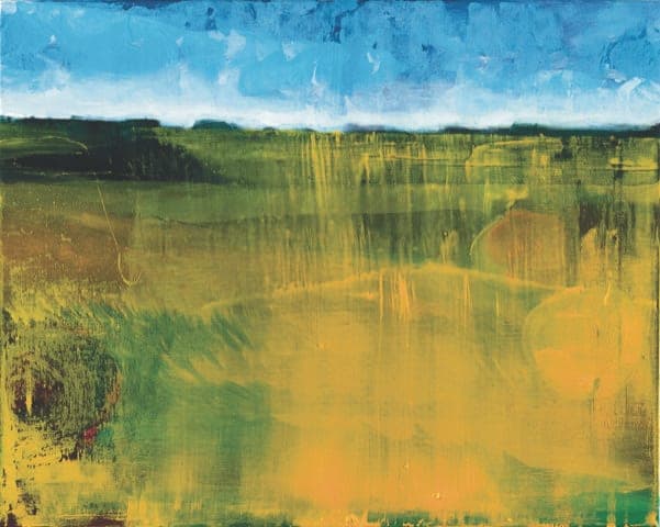 A green and gold field beneath a bright blue sky — a horizontal landscape.