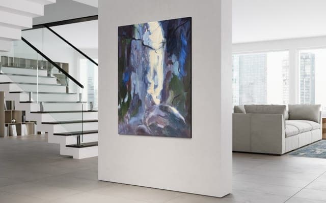 One of Iwona's paintings on the wall of a modern loft beside a floating staircase.