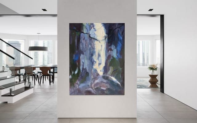 A painting hung in a bright, open-plan dining room.
